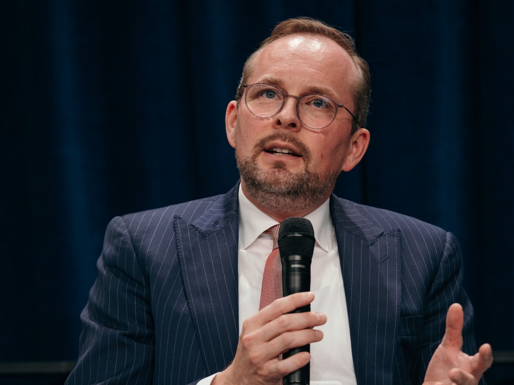 Maximilian A. Freier speaking on a panel